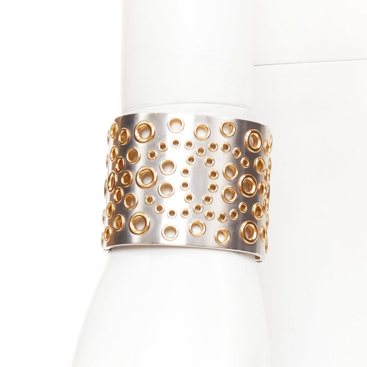 CHANEL B16 silver tone gold CC logo punctured grommet eyelet cuff bangle