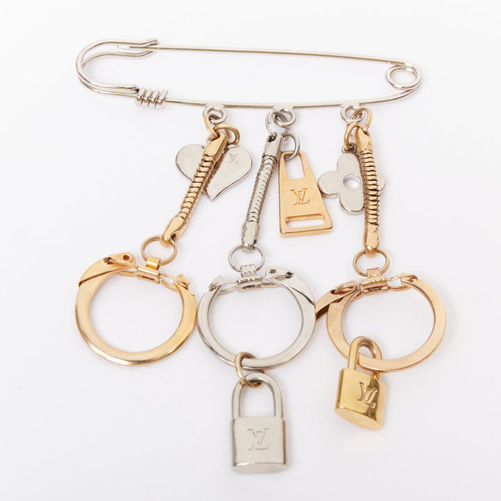 LOUIS VUITTON palladium gold plated pin LV lock heart flower keyring bag charm