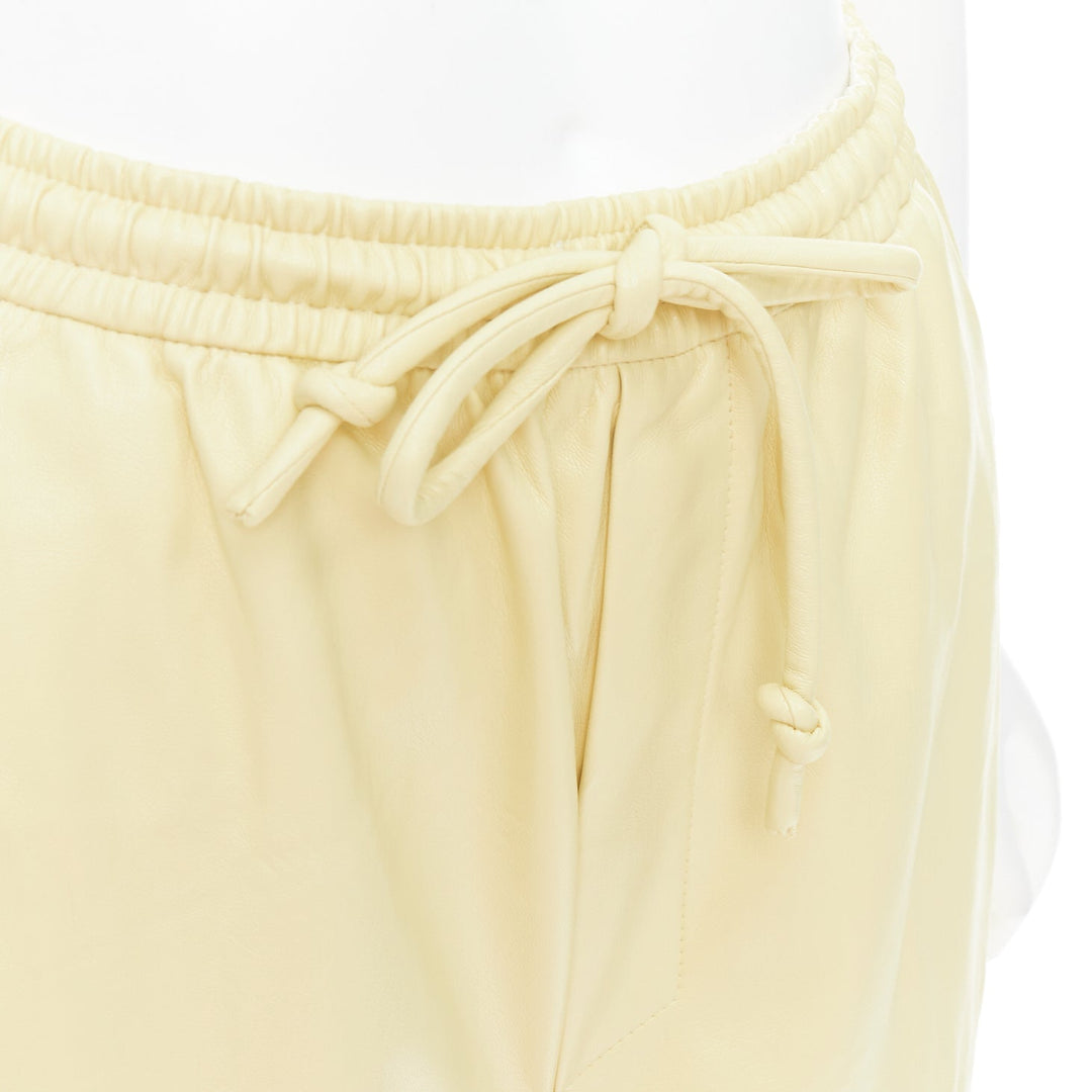 NANUSHKA  Munira Okobor butter yellow vegan leather drawstring bermuda shorts XS