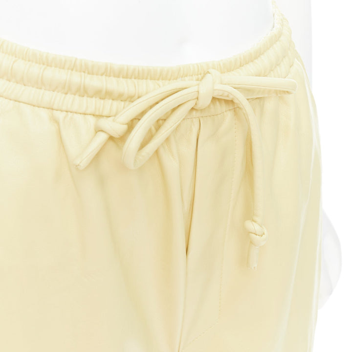 NANUSHKA  Munira Okobor butter yellow vegan leather drawstring bermuda shorts XS