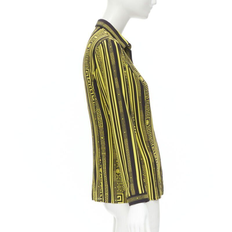 Female mannequin wearing Versace by Donatella Versace Greca silk shirt Yellow Silk Women Top in Size IT38 | Available at JHROP