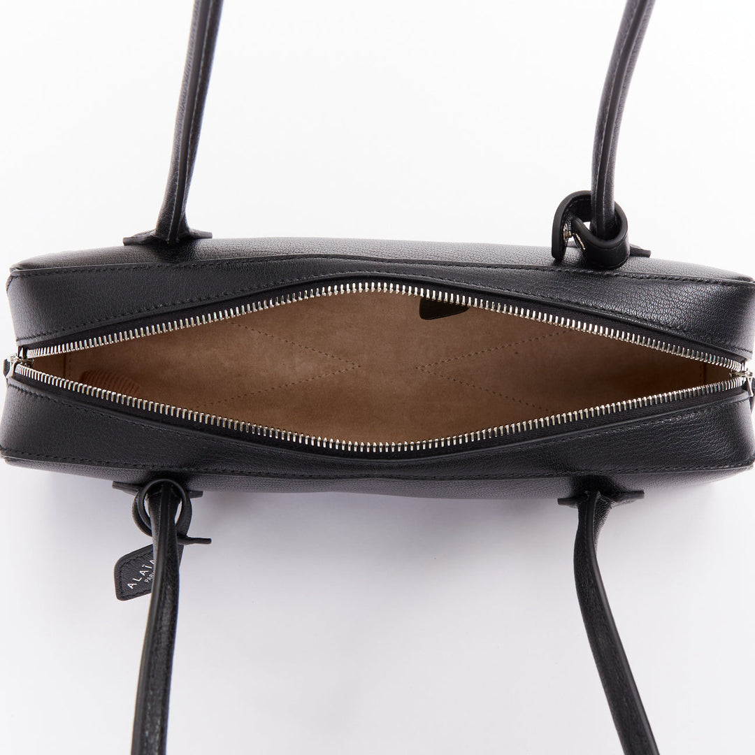 ALAIA Le Teckel black leather elongated long handle double zip bag