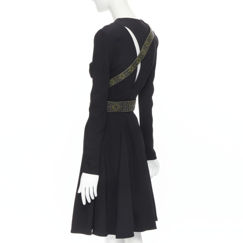 Female mannequin wearing Versace by Donatella Versace Leather harness cut out dress Runway Black Viscose Women Cocktail Dresses in Size IT38 | Available at JHROP