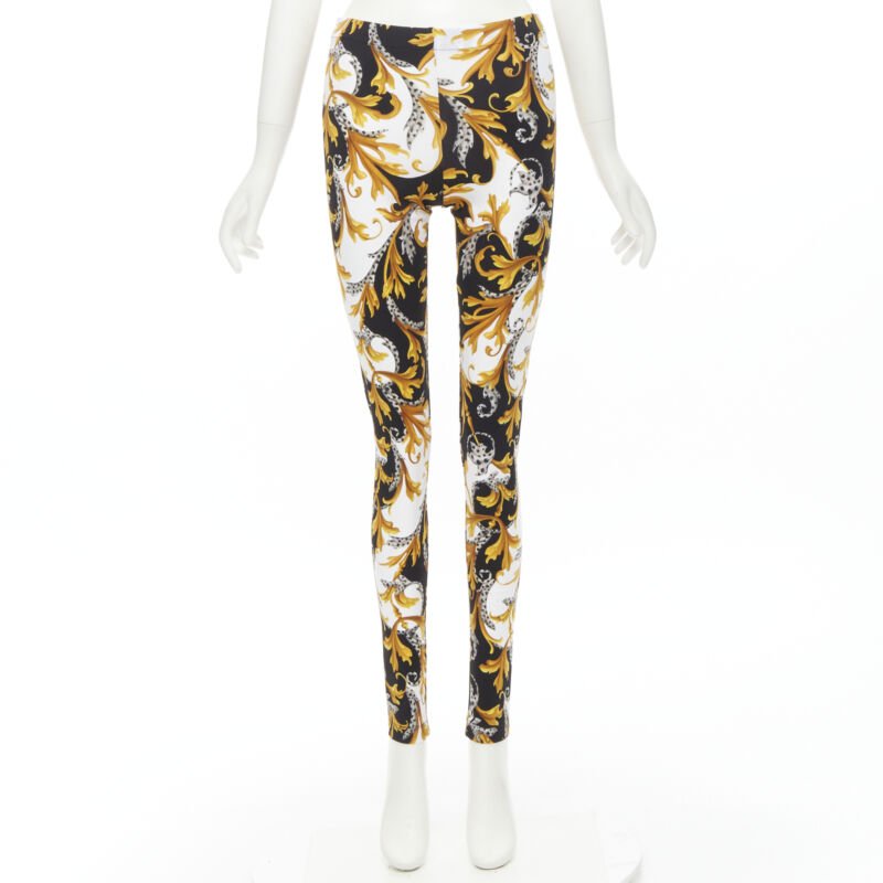 Female mannequin wearing Versace by Donatella Versace Barocco Acanthus Gold Polyamide Women Pants in Size IT42 | Available at JHROP