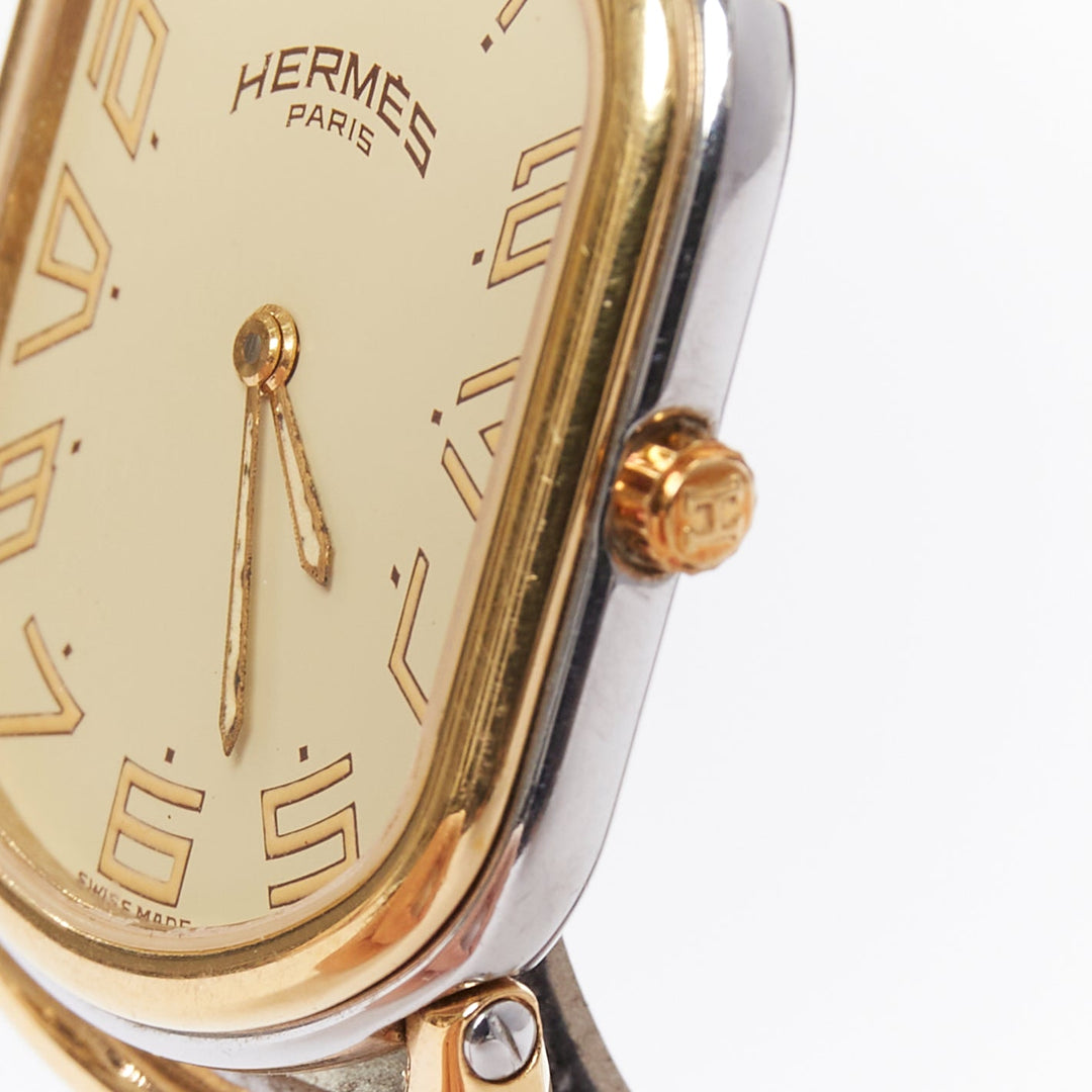 HERMES Rallye two-tone stainless steel gold plated saddle oval quartz watch