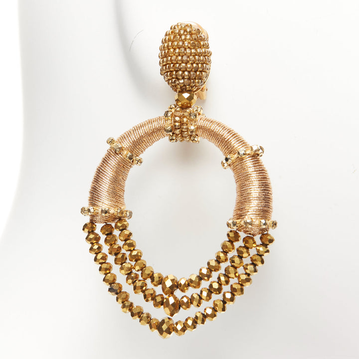 Female mannequin wearing Oscar de la Renta Gold Metal Women Jewelry Earring in Size  | Available at JHROP