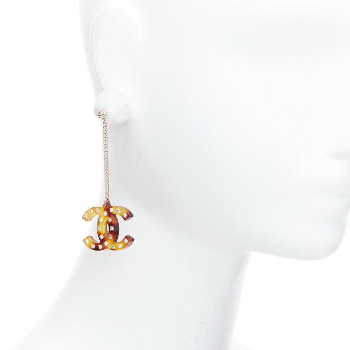 Female mannequin wearing Chanel by Virginie Viard 2018 Brown Resin Women Jewelry Earring in Size  | Available at JHROP