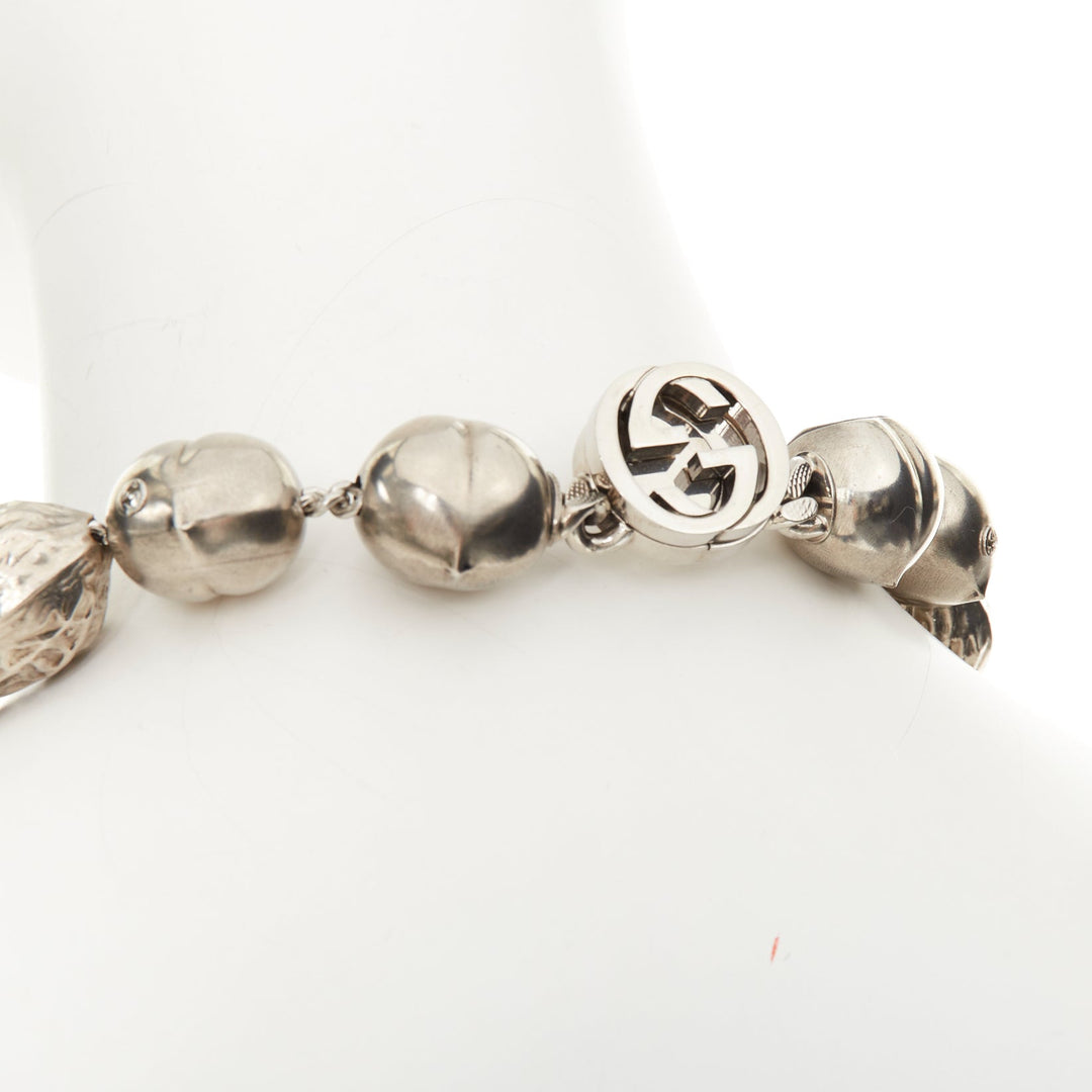 GUCCI Runway hazelnut peanut charm textured interlocking GG silver tone necklace