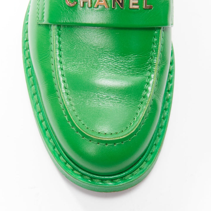 rare CHANEL PHARRELL green leather logo embellished slip on loafer flats EU37.5