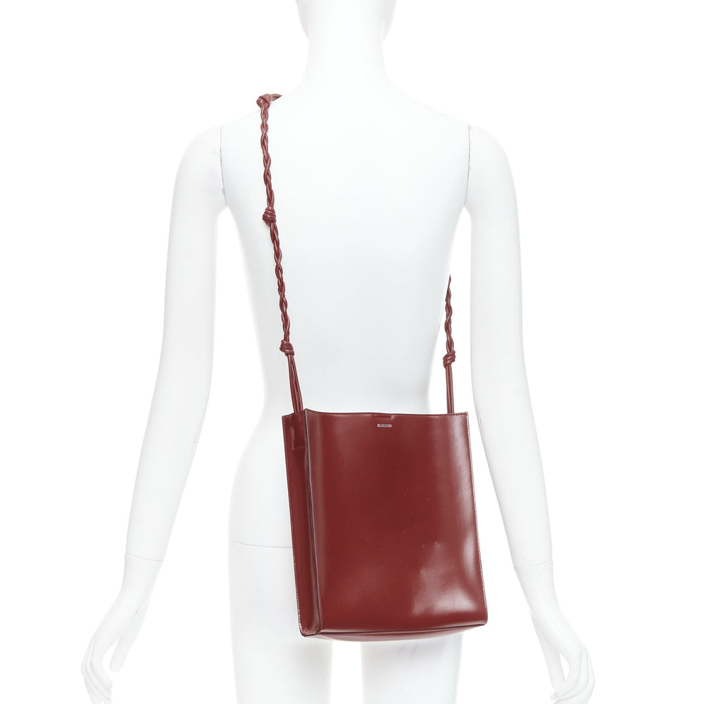 Female mannequin wearing Jil Sander Tangle Burgundy Leather Women Bag in Size  | Available at JHROP