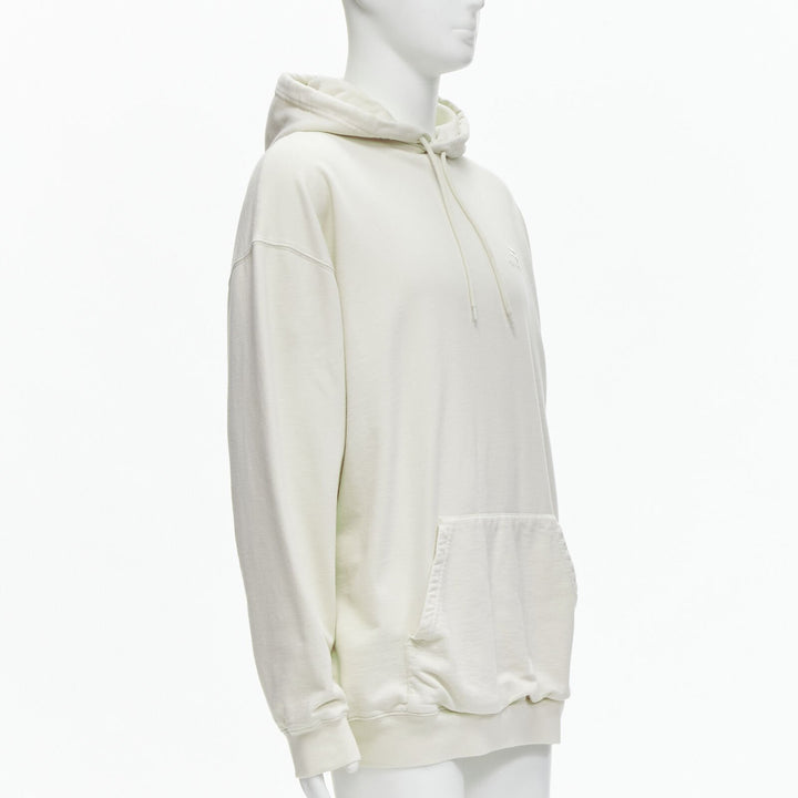 Male mannequin wearing Balenciaga by Demna 2021 Ecru Cotton Men Hoodies in Size  L | Available at JHROP