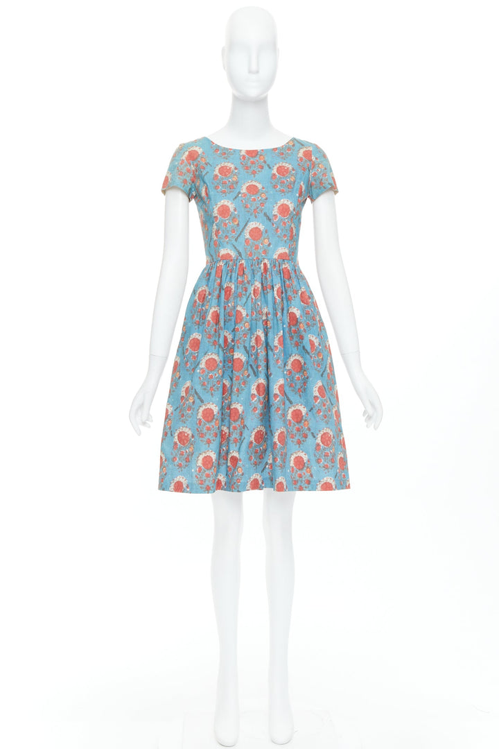 sachin and babi light blue dress Kiernan Shipka in a pale pink Oscar de la Renta cocktail dress with silver  ankle sandals