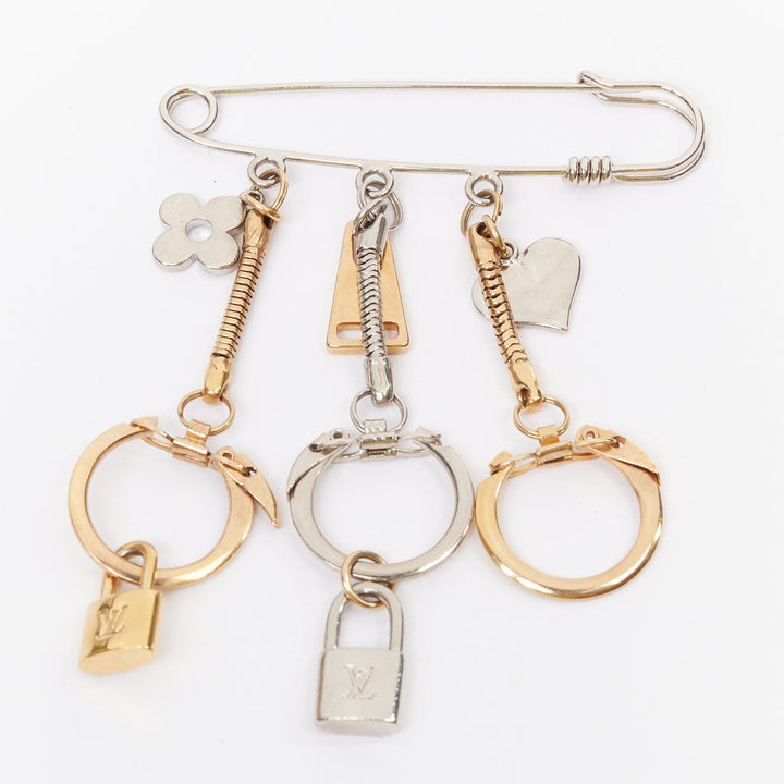 LOUIS VUITTON palladium gold plated pin LV lock heart flower keyring bag charm