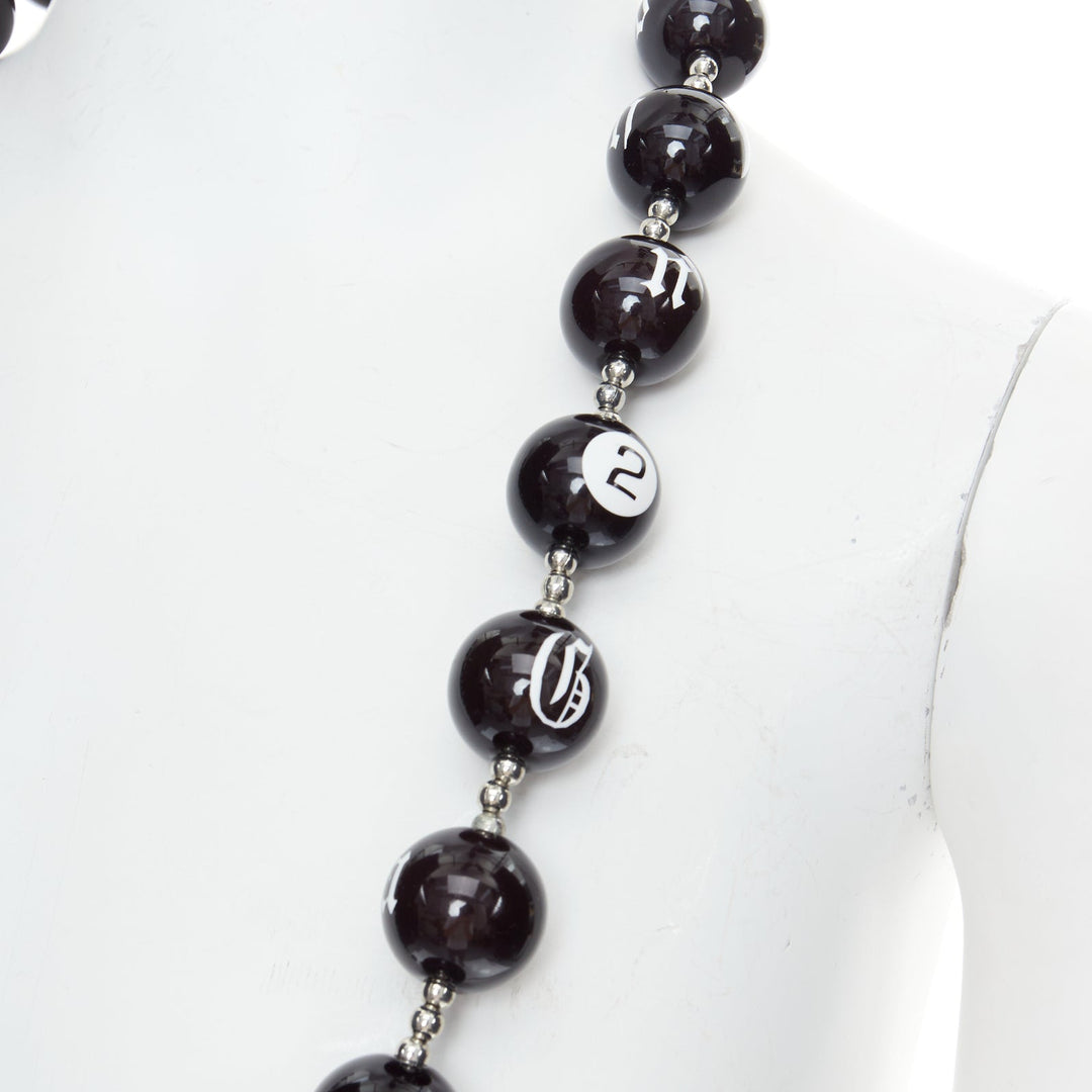 Male mannequin wearing John Galliano by John Galliano Black Acrylic Men Jewelry Necklace in Size  | Available at JHROP