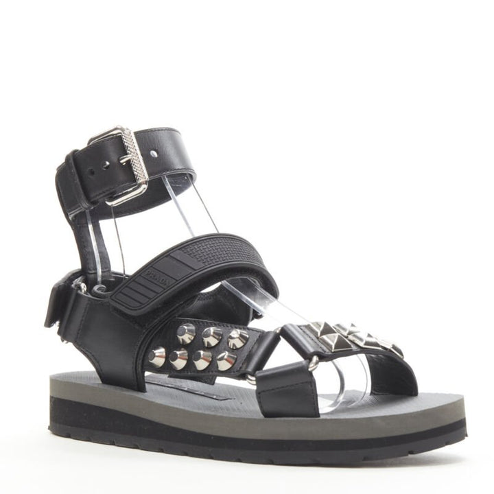 Female mannequin wearing Prada by Miuccia Prada Black Leather Women Sandals in Size EU36 | Available at JHROP