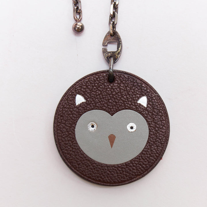 HERMES Owl brown textured leather cartoon round palladium charm