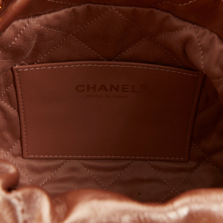 CHANEL 2023 Runway 22 Mini rose gold metallic calfskin leather drawstring bag