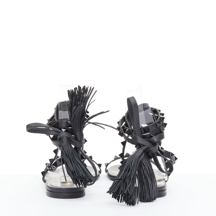 VALENTINO Rockstud black leather wraparound lace up tassel gladiator flats EU38