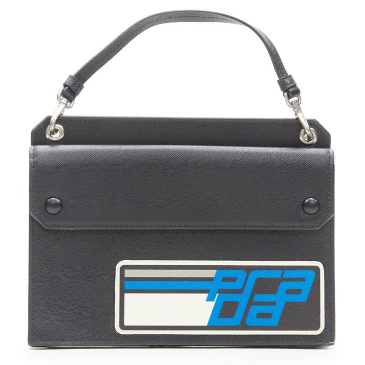 PRADA Racing Graphic Logo black saffiano flap front pocket flat top handle bag