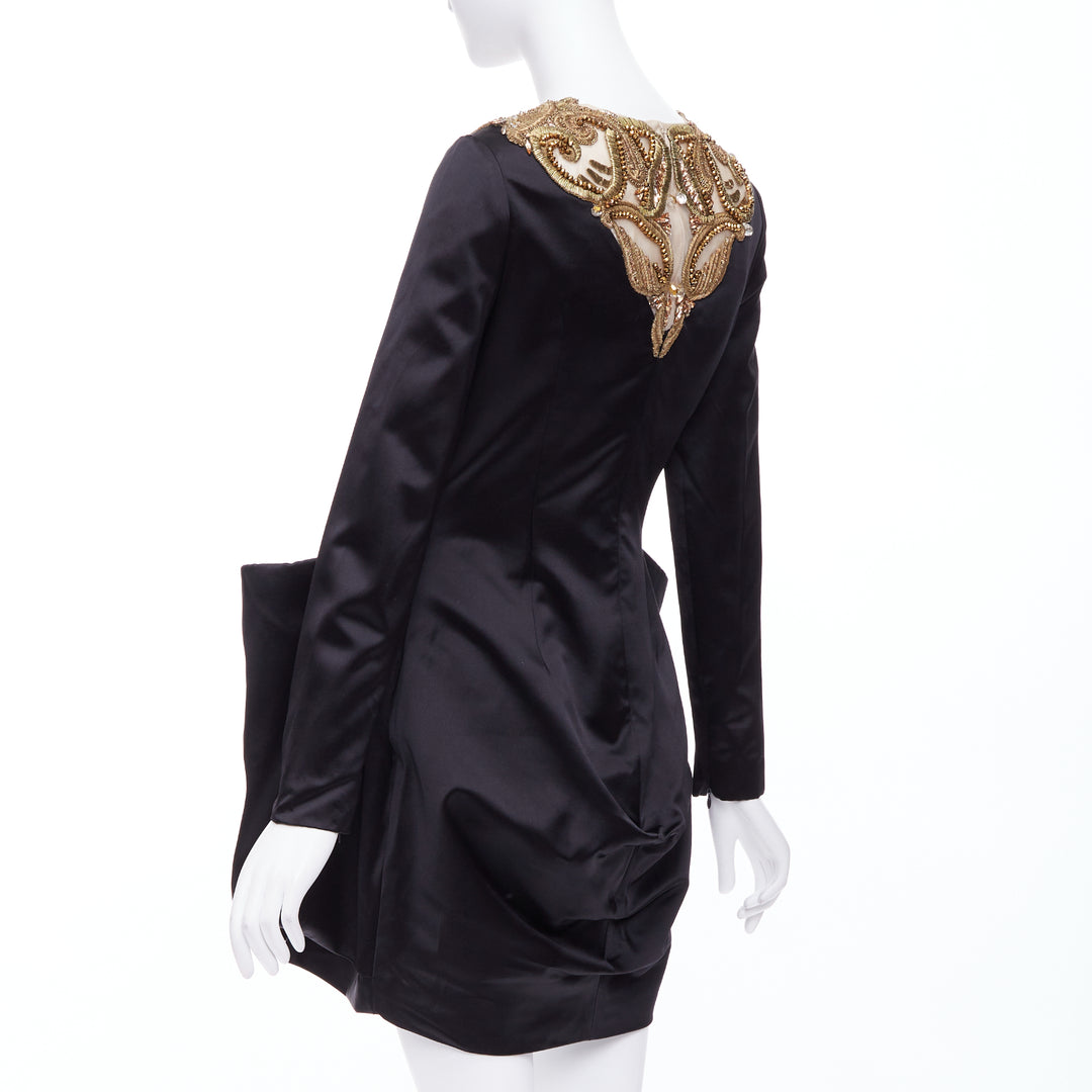 alexander mcqueen black gold dress Alexander McQueen Paris Ready to Wear Autumn Winter Final Show Black gold leaf pattern structured jacket, matching maxi skirt Stock Photo