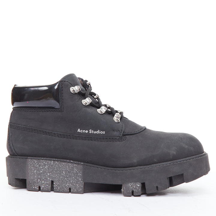 Female mannequin wearing Acne Studios Tinnie Black Leather Women Boots in Size EU38 | Available at JHROP