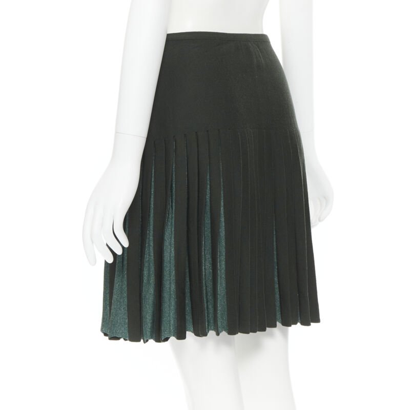 Female mannequin wearing Alaia by Azzedine Alaia Pleated flared wrap skirt Green Wool Women Skirt in Size FR40 | Available at JHROP