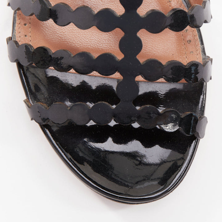 ALAIA black patent leather laser cut scalloped cage gladiator flat sandals EU36