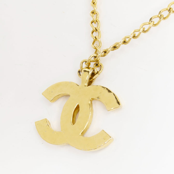 CHANEL 2023 Monte Carlo gold black glitter foil resin CC logo pendant  necklace