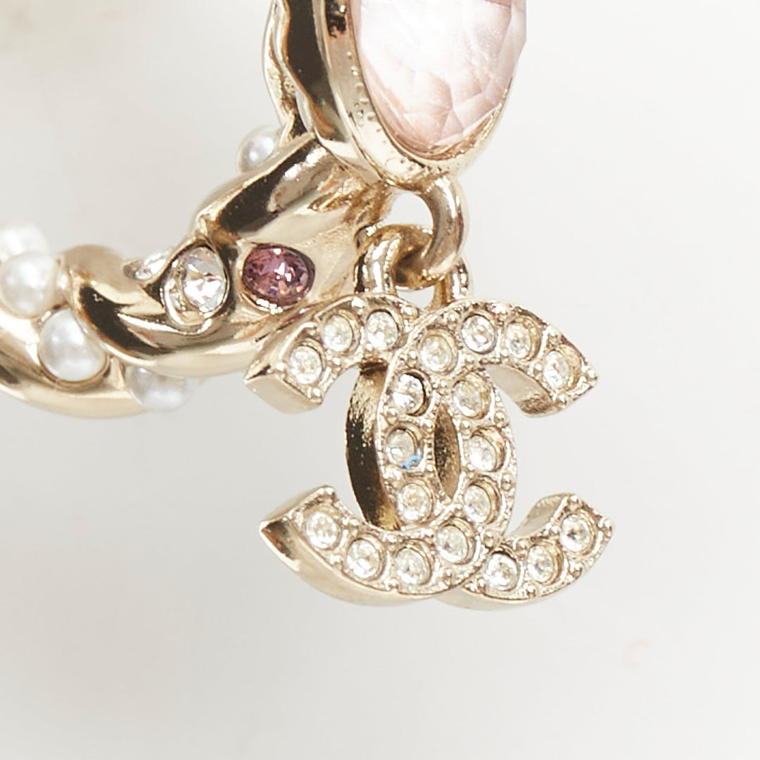 CHANEL 2023 Runway pink stone twisted chain CC crystal rhinestone hoop earrings