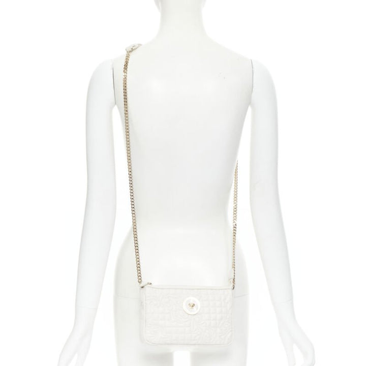 Female mannequin wearing Versace by Donatella Versace White Vanitas crossbody bag White Leather Women Bag in Size  | Available at JHROP