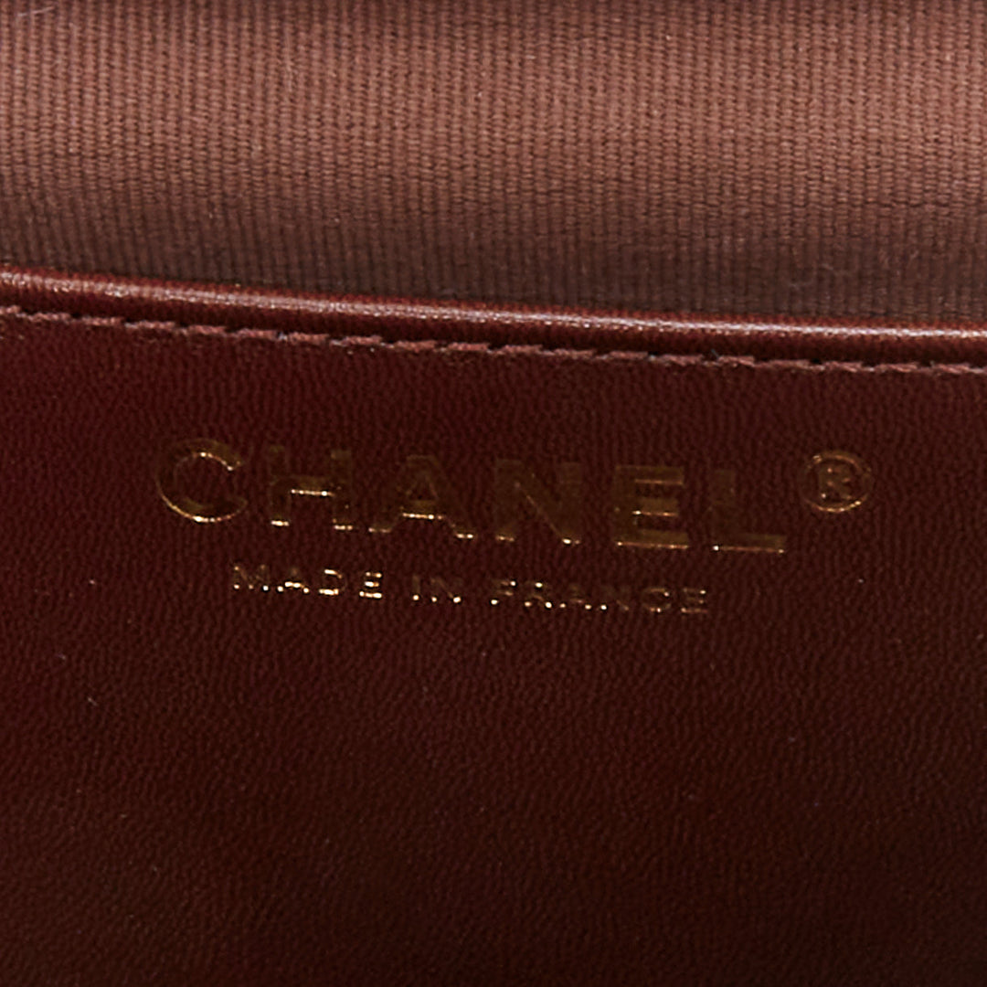 CHANEL 2023 burgundy quilted lambskin ornate CC turnlock seasonal mini flap bag