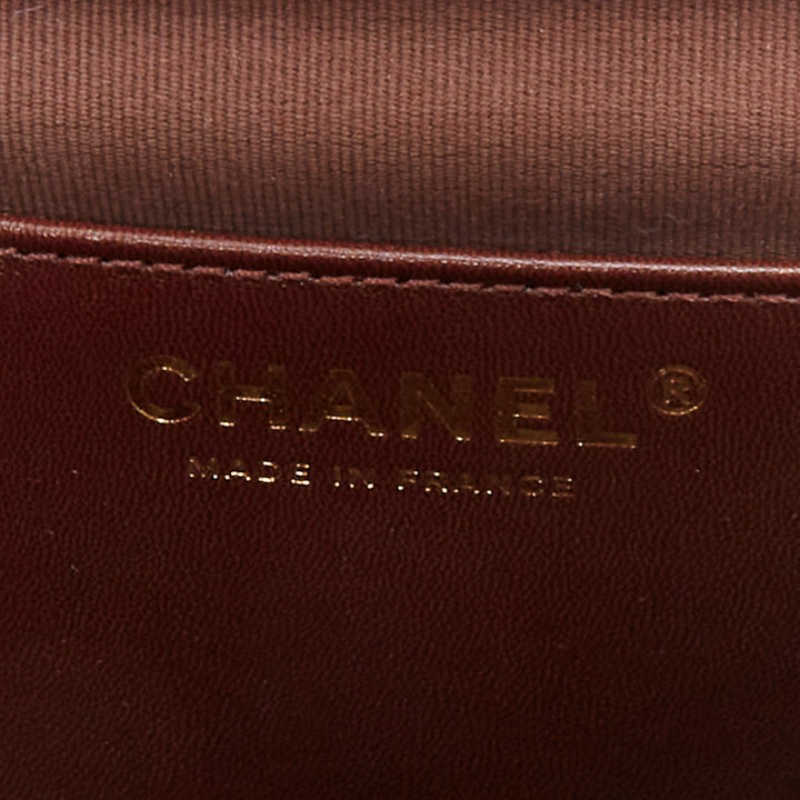 CHANEL 2023 burgundy quilted lambskin ornate CC turnlock seasonal mini flap bag