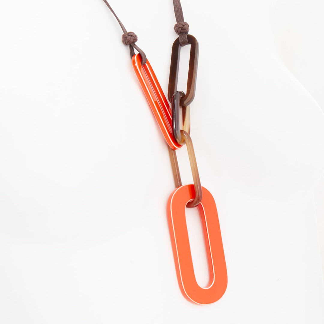 HERMES Mayance orange lacquered buffalo horn oval link pendant necklace