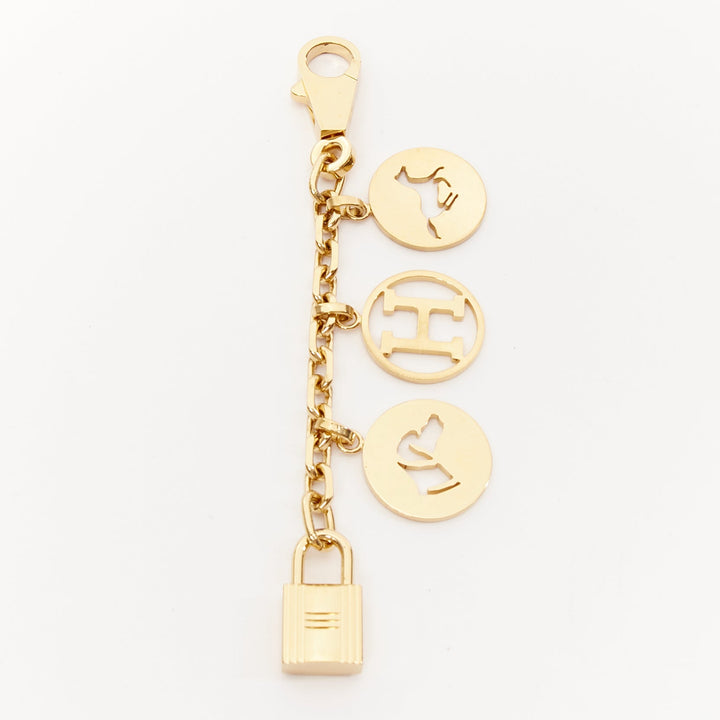  mannequin wearing Hermes Gold Metal Key Chain in Size  | Available at JHROP