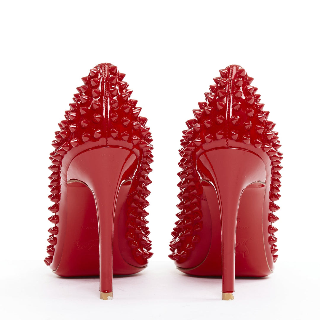 CHRISTIAN LOUBOUTIN Pigalle Spikes 100 red patent leather studded pumps EU38