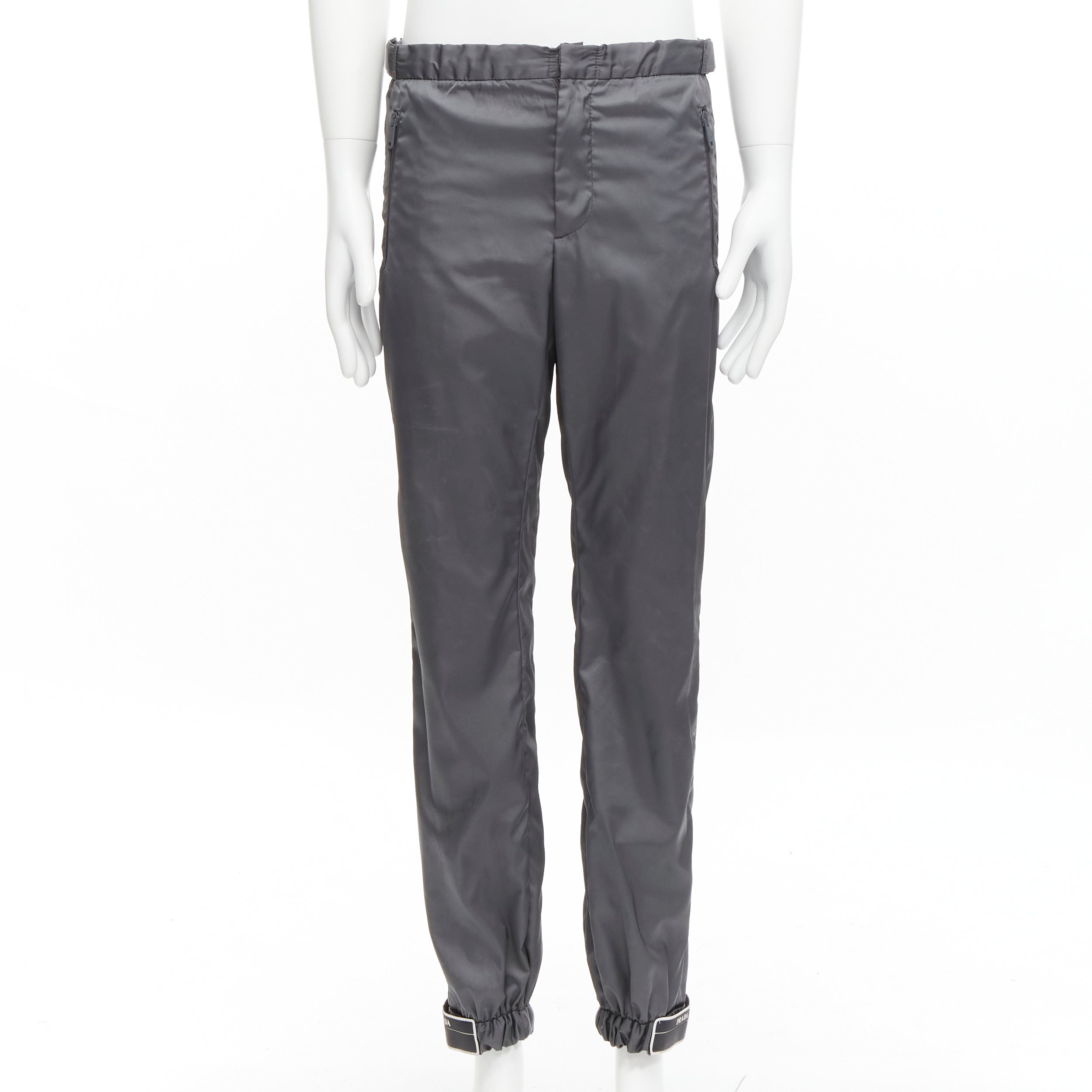 100% Authenticity Guaranteed Prada Grey Nylon Pants on Sale. Available at  JHROP jhrop_official