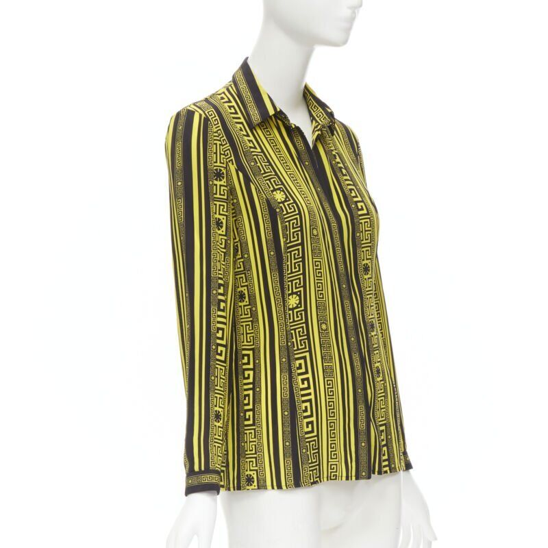 Female mannequin wearing Versace by Donatella Versace Greca silk shirt Yellow Silk Women Top in Size IT38 | Available at JHROP