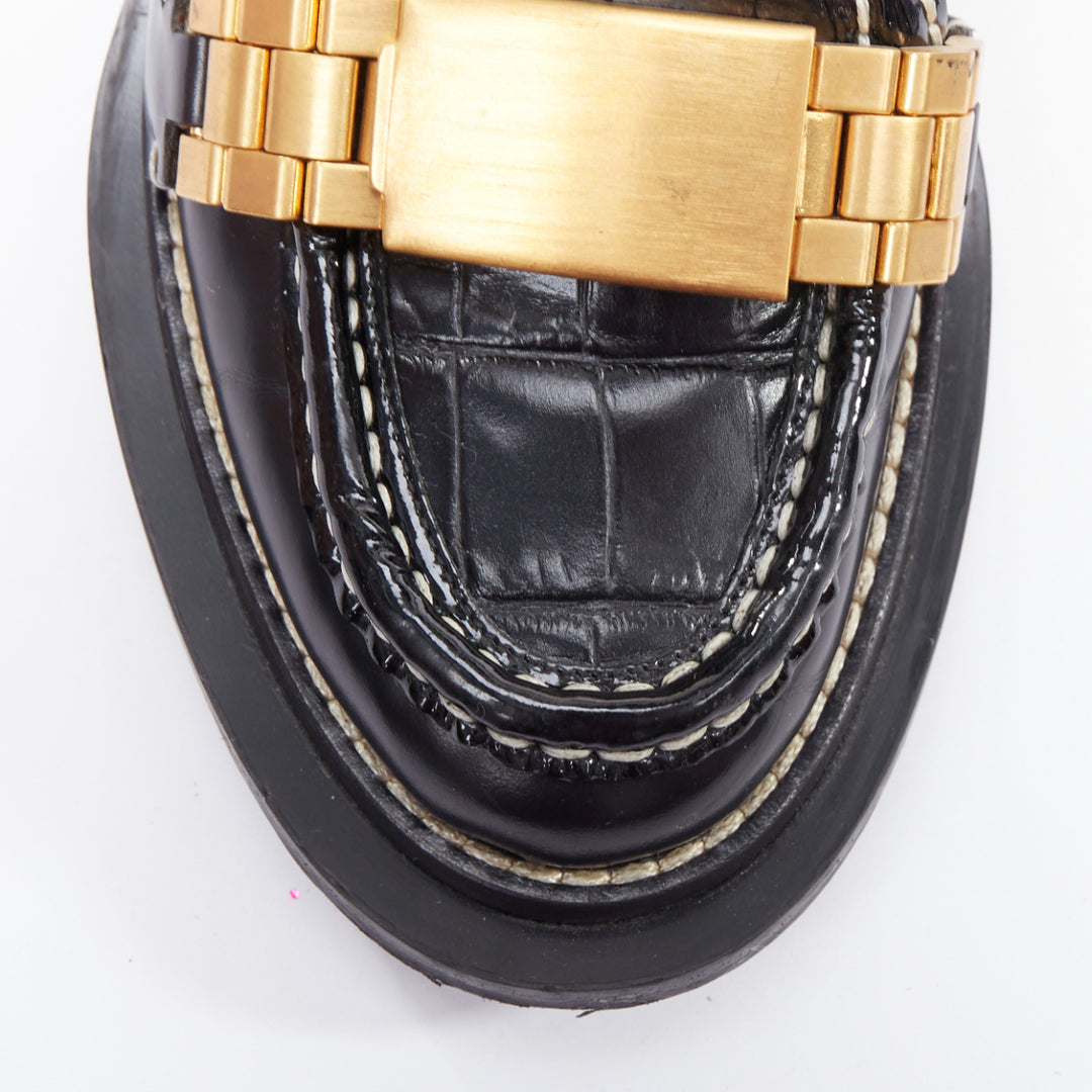 Female mannequin wearing Acne Studios Penny Watch Black Leather Women Flats in Size EU38 | Available at JHROP