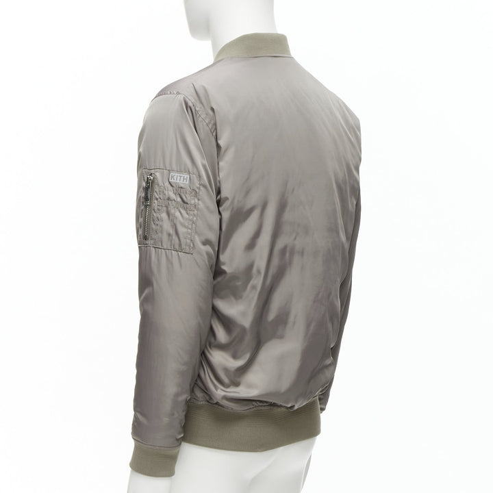 Male mannequin wearing Kith Grey Polyester Men Bomber Jacket in Size  M | Available at JHROP