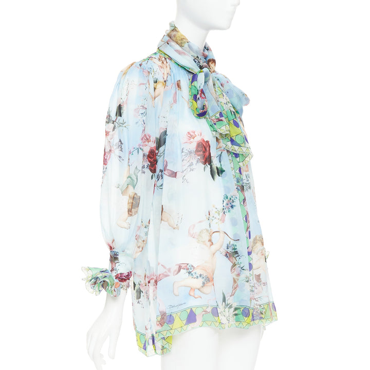 DOLCE GABBANA  100% silk blue Cherub Cupids print pussybow sheer blouse IT40 S