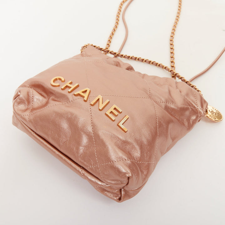 CHANEL 2023 Runway 22 Mini rose gold metallic calfskin leather drawstring bag