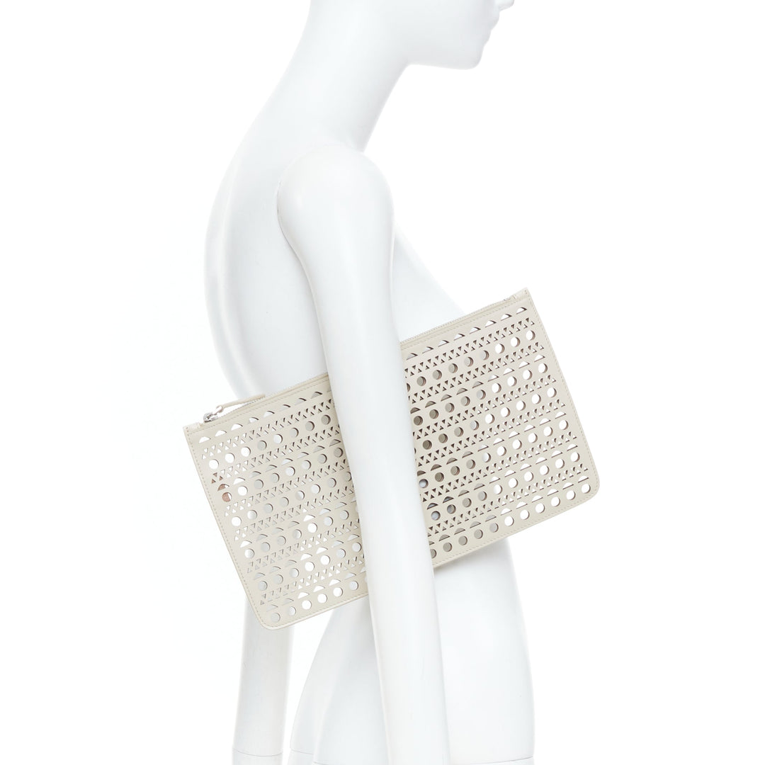 ALAIA Vienne laser cut tan beige neutral calfskin flat zip pouch clutch bag