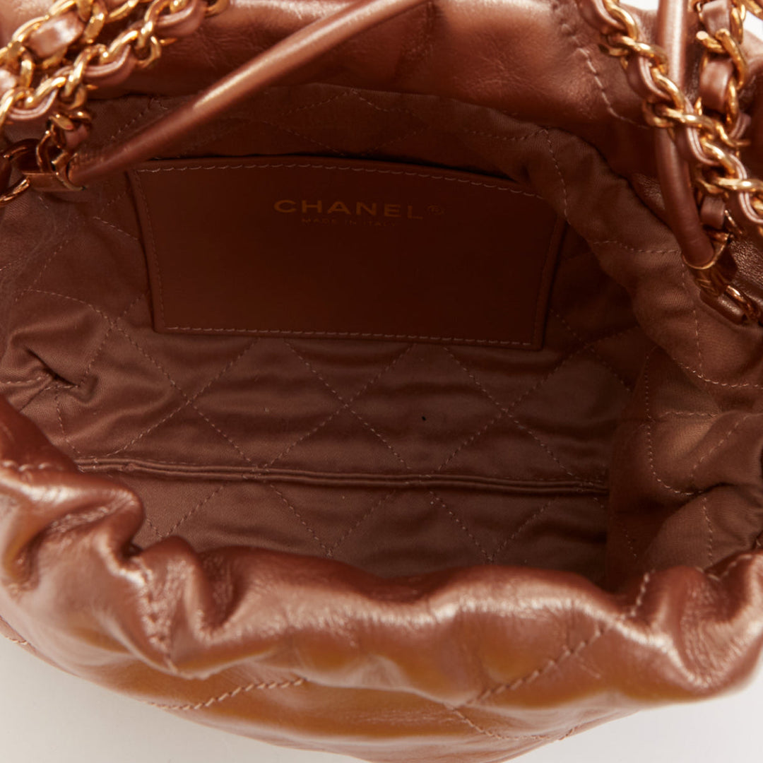CHANEL 2023 Runway 22 Mini rose gold metallic calfskin leather drawstring bag