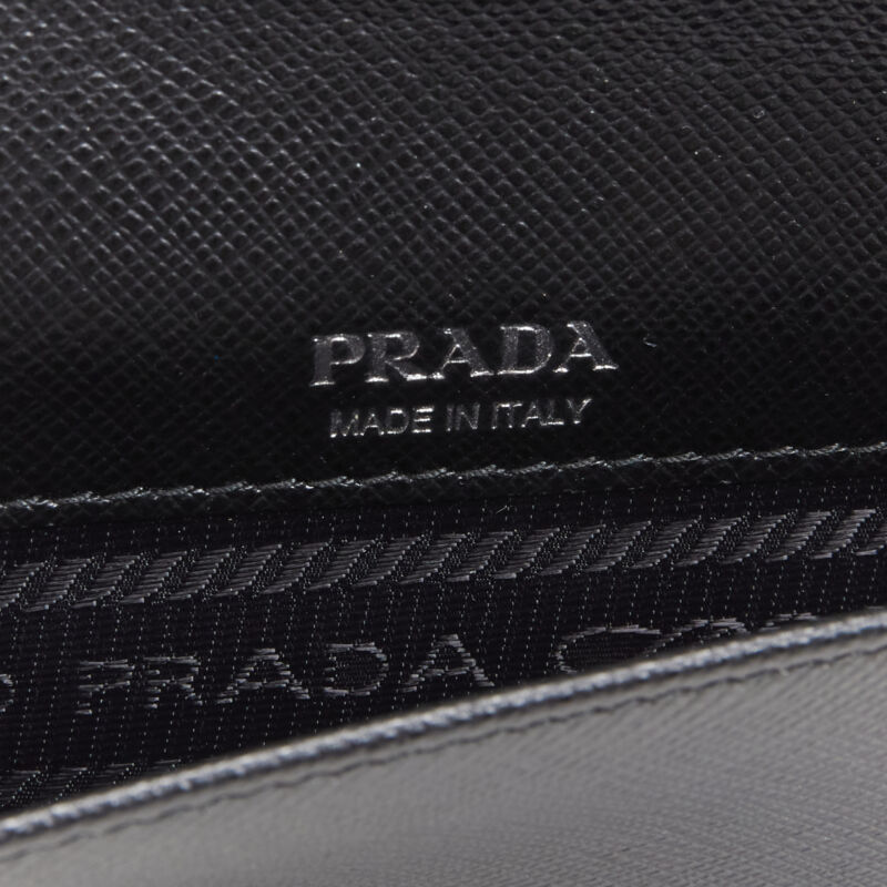PRADA Racing Graphic Logo black saffiano flap front pocket flat top handle bag