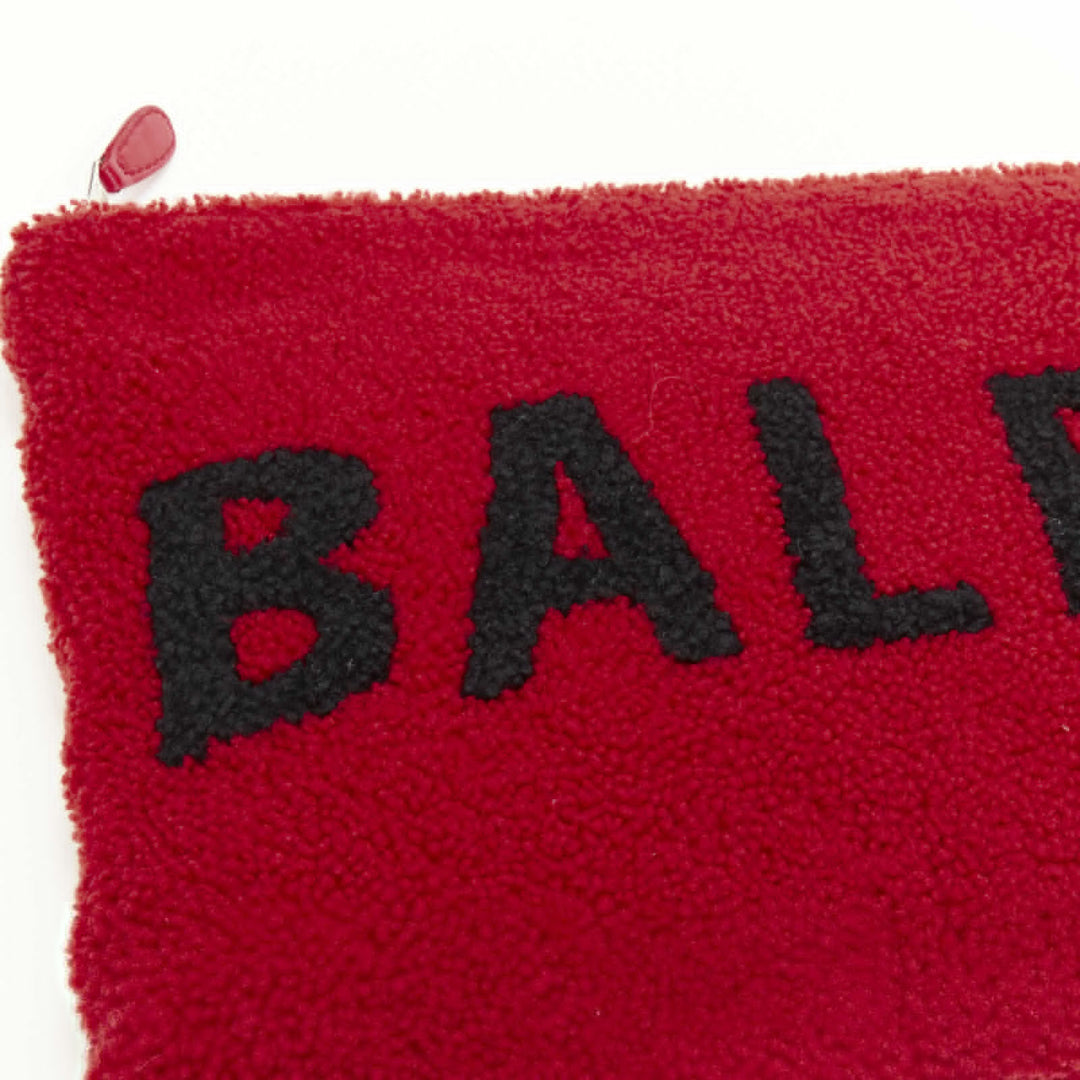 BALENCIAGA Demna logo red black dyed merino lamb shearling zip clutch bag