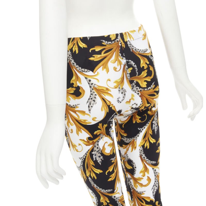 Female mannequin wearing Versace by Donatella Versace Barocco Acanthus Gold Polyamide Women Pants in Size IT42 | Available at JHROP