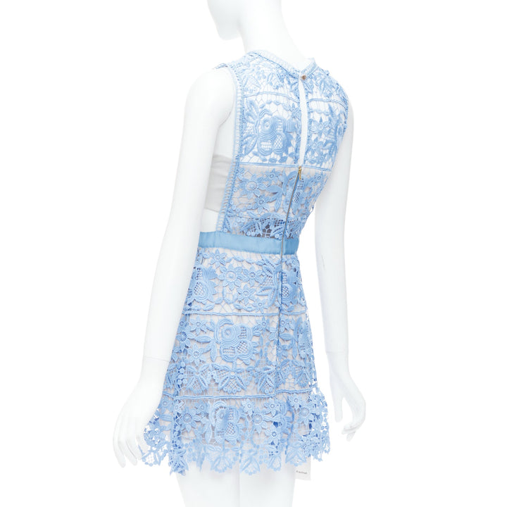 Female mannequin wearing Self Portrait Lace Peplum Blue Polyester Women Cocktail Dresses in Size US8 | Available at JHROP