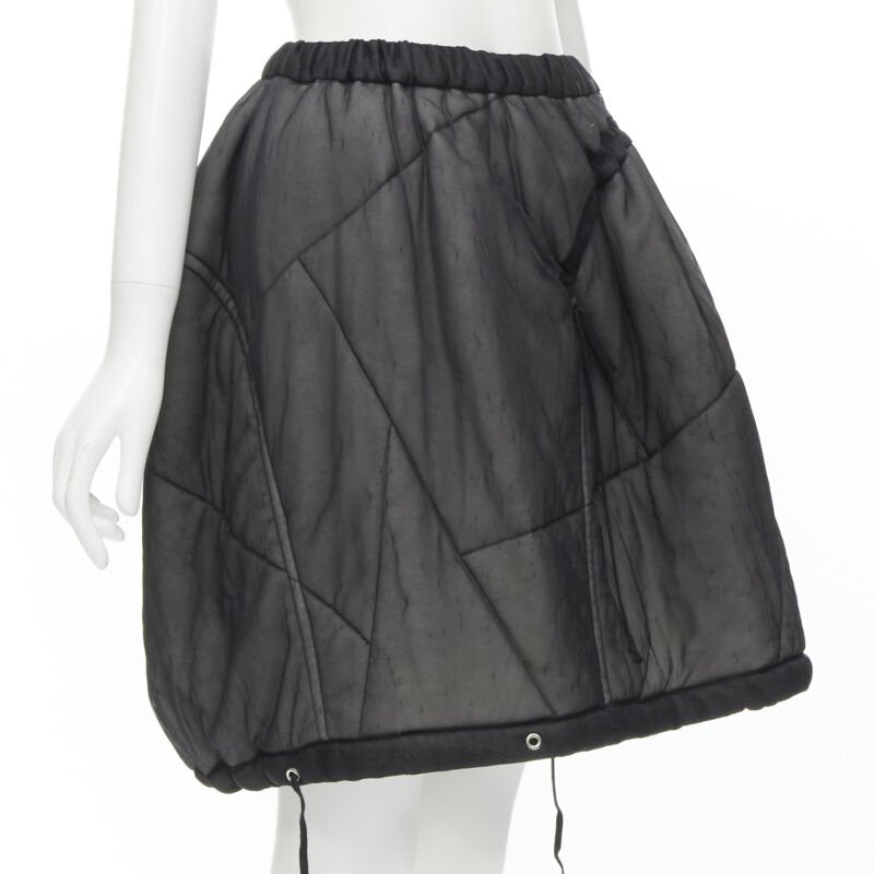 Female mannequin wearing Comme Des Garcons by Rei Kawakubo 1990 Black Nylon Women Skirt in Size  M | Available at JHROP