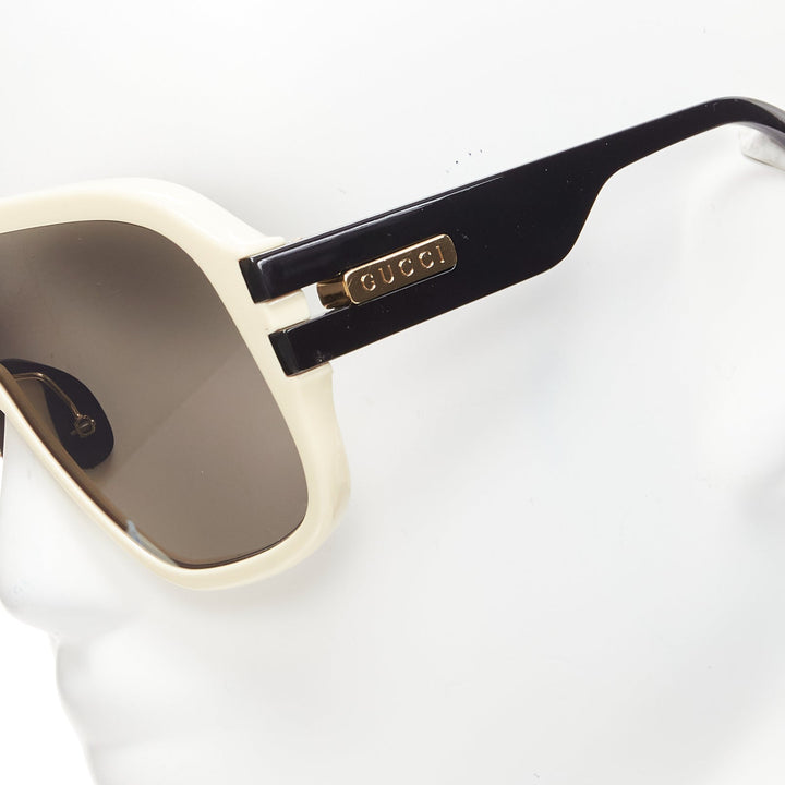 GUCCI GG0900S gold black logo cream frame black lens oversized shield sunglasses