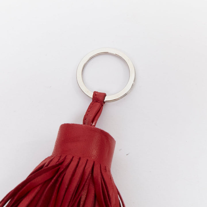 HERMES Milo Carmen red leather tassel silver ring bag charm